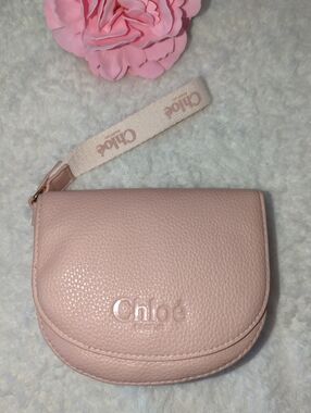 Chloé Parfum Pebbled Leather Wristlet Mini Saddle Pouch Logo Strap in Pale Pink